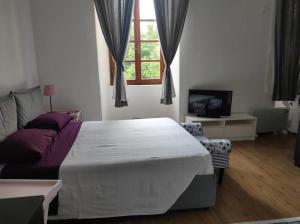 Кровать или кровати в номере Archi e Colonne