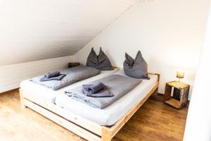 a bedroom with two beds in a attic at Ferienwohnung Kaufbeuren in Kaufbeuren