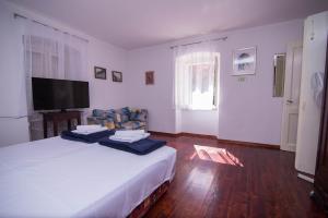 Posteľ alebo postele v izbe v ubytovaní Red House Veli Lošinj