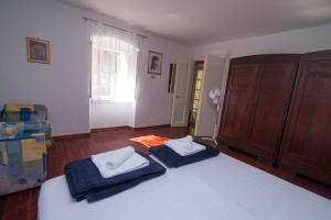 Posteľ alebo postele v izbe v ubytovaní Red House Veli Lošinj