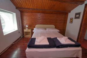 Posteľ alebo postele v izbe v ubytovaní Red House Veli Lošinj