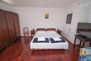 Posteľ alebo postele v izbe v ubytovaní Red House Veli Lošinj
