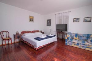 Posteľ alebo postele v izbe v ubytovaní Red House Veli Lošinj