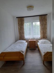 Postel nebo postele na pokoji v ubytování Všeborky
