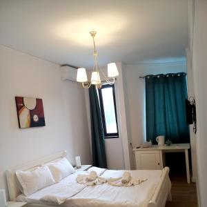 Postel nebo postele na pokoji v ubytování Adrys Boutique Villa