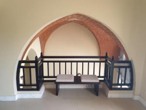 a bench sitting in an archway in a room at Peaceful Private Villa at Five Star Beach Resort in Ras al Khaimah