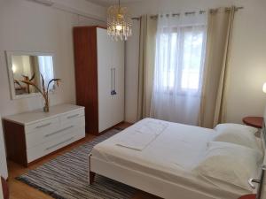 Ένα ή περισσότερα κρεβάτια σε δωμάτιο στο Apartments Hani
