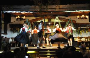 a group of people in dresses on a stage at Kaiserhotel Neuwirt in Oberndorf in Tirol