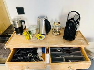 a wooden counter top with a drawer in a kitchen at Private studio, patio garden and free car parking in Amsterdam