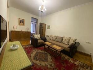 a living room with a couch and a table at Apartment at Bagramyan Street in Yerevan