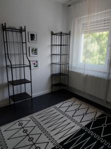 a room with a room with a window and a rug at Wohnung Mona in Herford