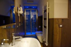 a bathroom with a sink and a toilet and a window at GAPO Rooms in Orta Nova +57 photos
