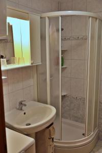 a bathroom with a shower and a sink at Apartment Carole in Trogir +9 photos