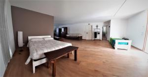 A bed or beds in a room at B&B Baratoff