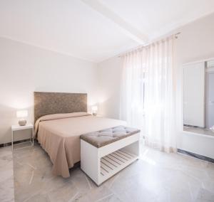 Postel nebo postele na pokoji v ubytování Hotel Cavalieri Del Mare