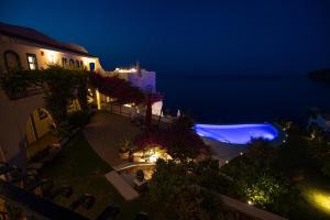 an aerial view of a building at night at Hotel Punta Scario in Malfa