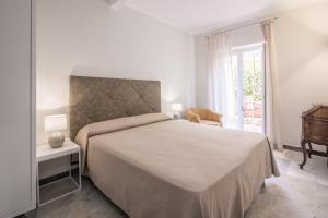 Postel nebo postele na pokoji v ubytování Hotel Cavalieri Del Mare