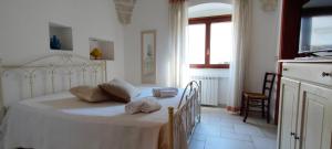 Letto o letti in una camera di Le Bianche Suites Ostuni