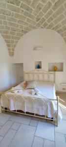 Letto o letti in una camera di Le Bianche Suites Ostuni