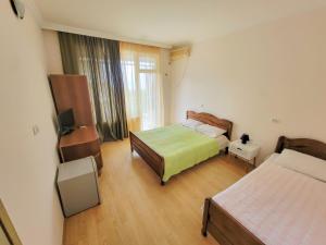Кровать или кровати в номере Guest House Kvariati