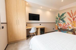 Postel nebo postele na pokoji v ubytování Antares Rooms and Suites