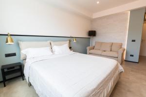 Postel nebo postele na pokoji v ubytování Antares Rooms and Suites