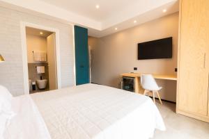 Postel nebo postele na pokoji v ubytování Antares Rooms and Suites