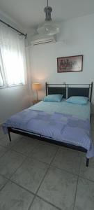 Postel nebo postele na pokoji v ubytování Sunset Beach House Possidi
