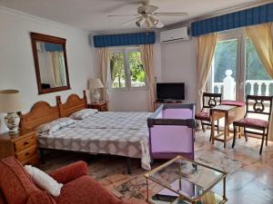 A television and/or entertainment centre at Finca Batan