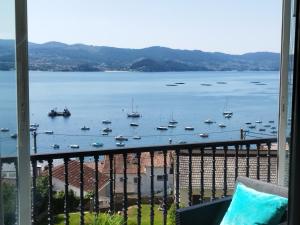 a view of a harbor with boats in the water at Apartamento con vistas en Raxó in Raxo