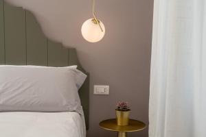 Postel nebo postele na pokoji v ubytování NUE SUITES