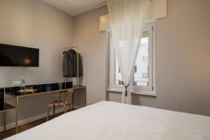 Postel nebo postele na pokoji v ubytování NUE SUITES
