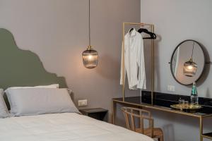 Postel nebo postele na pokoji v ubytování NUE SUITES