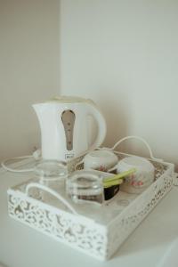 a white mixer sitting on top of a table at B&B Sobe Lušina in Sečovlje