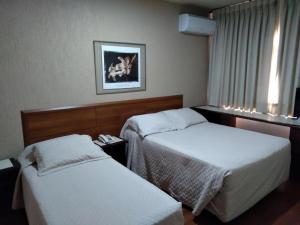 מיטה או מיטות בחדר ב-Hotel Santa Fé