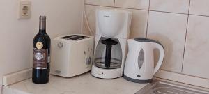 a counter with a blender and a bottle of wine at Green Villa in Banjole +29 photos