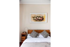 Posteľ alebo postele v izbe v ubytovaní Arkadia Homely Apartament