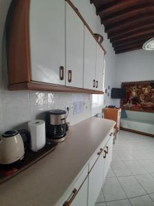 A kitchen or kitchenette at Kafenes house Αναπαλαιώμενο παραδοσιακό σπίτι