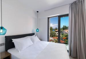 Säng eller sängar i ett rum på Azul Apartments