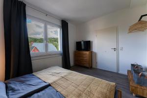Postel nebo postele na pokoji v ubytování Ferienwohnung am Steinbach 1
