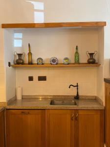 a kitchen with a sink and a counter top at Casa Jaraíz - Centre town in Caravaca de la Cruz +53 photos