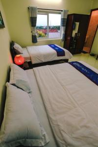 Postel nebo postele na pokoji v ubytování Harmony Hoian Homestay
