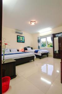 Postel nebo postele na pokoji v ubytování Harmony Hoian Homestay