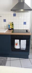 Kuchnia lub aneks kuchenny w obiekcie Joli appartement climatisé