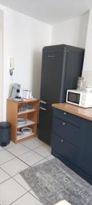 Kuchnia lub aneks kuchenny w obiekcie Joli appartement climatisé