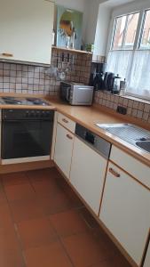 Kuchyň nebo kuchyňský kout v ubytování Ferienwohnung Westerheide
