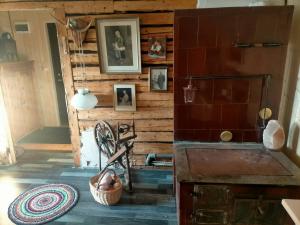 a room with a wooden wall with pictures on it at Lossi 8 -4 Põltsamaa Maida in Põltsamaa