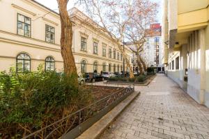 a brick sidewalk in front of a building at Károlyi street - central location quiet place 2ppl in Budapest