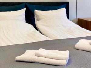 Postel nebo postele na pokoji v ubytování City Apartment Kuopio