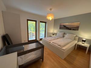 a bedroom with a bed and a desk in it at Willa Mare in Dębki +91 photos